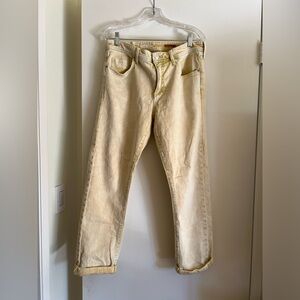 Faded yellow boyfriend jeans.